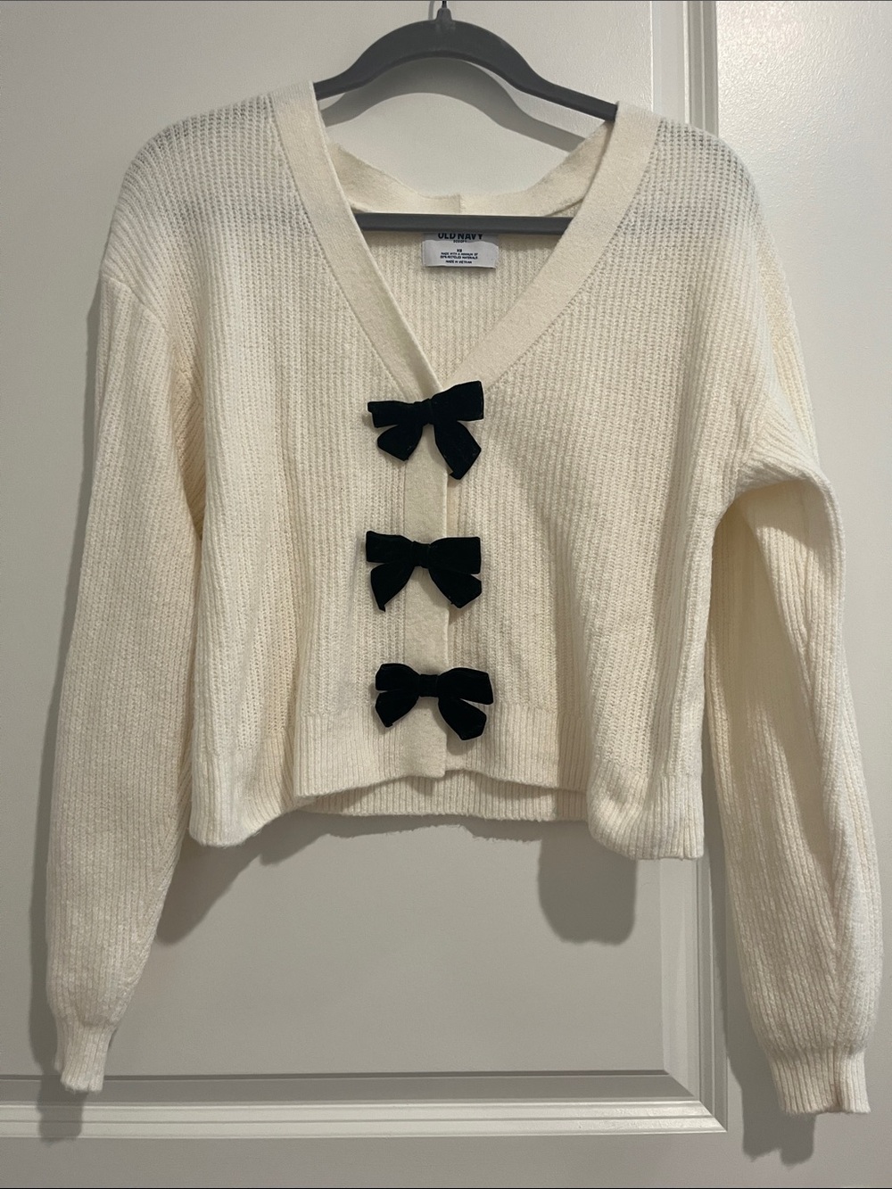 Old Navy Cream V‑Neck Sweater with Black Bow Details